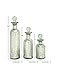 Deco 79 Glass Living Room Decorative Jars Slim Bottle Decorative Container with Crystal Toppers, Set of 3 Jar with Lid 12