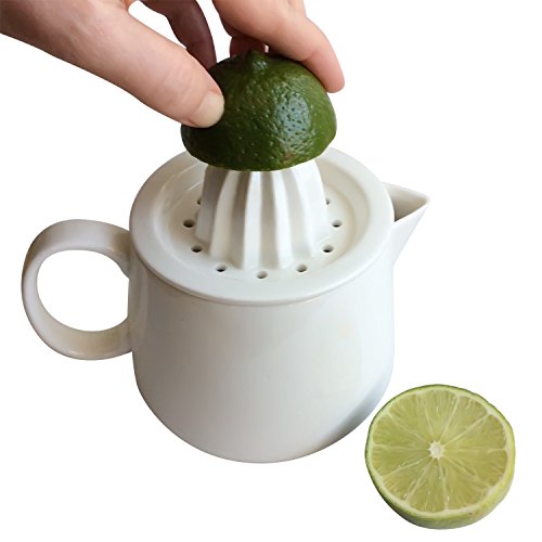Manual citrus juicer reamer strainer with white ceramic pitcher. Enjoy