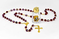 Virgin Mary Rosary Beads with a Bottle of BLESSED