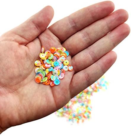 Colorful sequins in a cup, suitable for DIY projects.