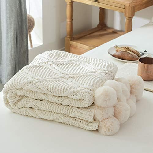 NOKOLULU 100% Natural Cotton Cable Knitted Throw Blanket with Cute Fluffy Pom Pom Decoration - Handmade Soft Warm Plush Throw Sleeping Cover Blanket for Kids or Adults on All Seasons(51"x63",Cream)
