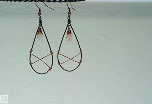 Teardrop earrings that have wire wrapped Xs and white and gold sunset glass teardrop focals.
