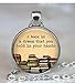Round 'A book is a dream you can hold in your hands' quote glass dome pendant necklace