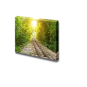 Railway Track Crossing Rural Landscape Under Evening Sunset Sky