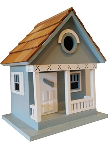 Blue lake cottage birdhouse is a whimsical and peaceful…