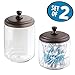 mDesign Modern Glass Bathroom Vanity Countertop Storage Organizer Canister Apothecary Jar for Cotton Swabs, Rounds, Balls, Makeup Sponges, Blender, Bath Salts - 2 Pack - Clear/Bronze