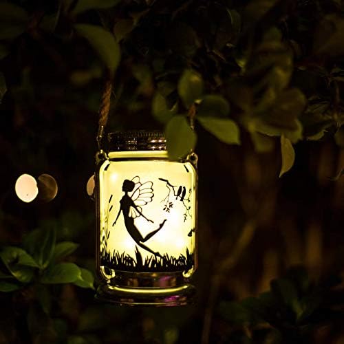 Solar fairy jar lantern glowing in an outdoor setting.