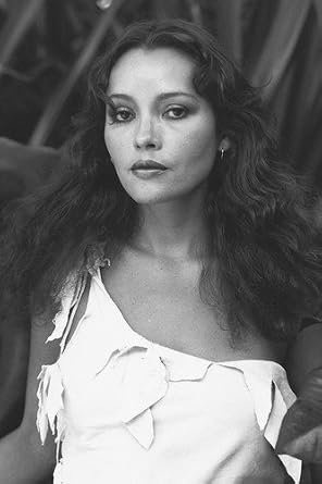 Barbara Carrera 24x36 Poster in White Outfit by Tree at Amazon's
