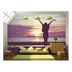 Woman Spreading Hands with Joy and Inspiration at Sunrise. - Removable Wall Mural | Self-Adhesive Large Wallpaper - 66x96 inches