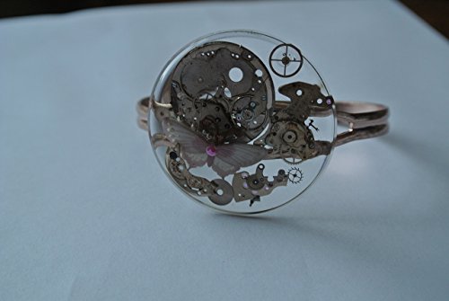 Time Flutters-Round watch crystal with Omega watch parts on arose cuff bracelet