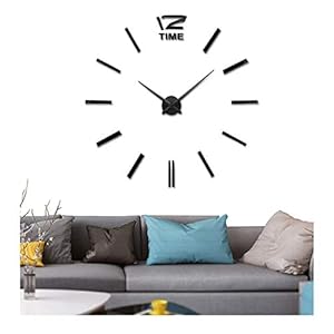 Wall clock above a gray couch