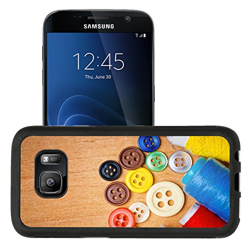 Liili Premium Samsung Galaxy S7 Aluminum Snap Case Colorful sewing buttons and thread reels on a wooden background with space for text IMAGE ID 12748222