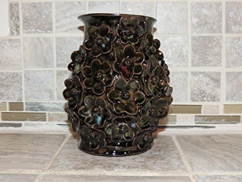 Hand thrown ceramic Vase. One of a kind Dark Teal speckled glaze. Has beautiful hand made 3-d flowers. Food and dishwasher safe.5.6 x 6 wide,Food,microwave and dishwasher safe.