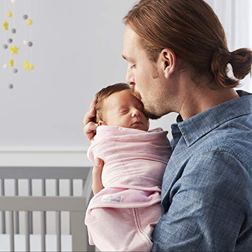 Child sleeping in arms, wrapped in cotton fabric, priced at $21.00.