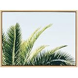 Kate and Laurel Sylvie Tropical Palm Under Blue Sky Lienzo enmarcado para pared, 23 x 33 Natural, Arte de pared inspirado en una escapada relajante para entrada, dormitorio, baño o sala de estar