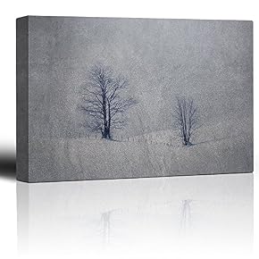 Lone Trees on Hills of Snow Against a Grainy Background