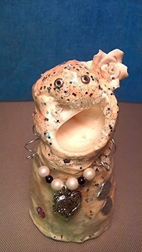 Lula Bell. Sea Monster Charm. A unique, one of a kind, hand sculptured gift. I have a pink flower in my hair and beady eyes. I worked in the sea circus with the other monsters.