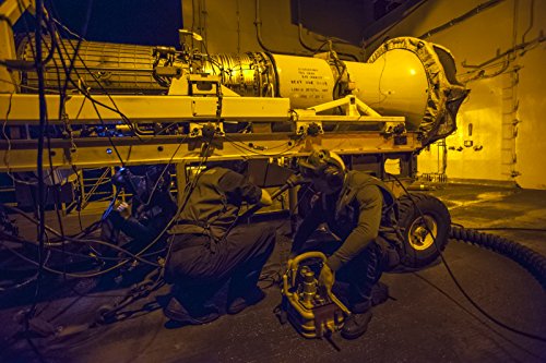 Home Comforts Canvas Print Sailors assigned to Aviation Intermediate Maintenance Department inspect an F404-GE-400 F/A-18C Hor Stretched Canvas 10 x 14