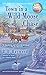 Town in a Wild Moose Chase: A Candy Holliday Murder Mystery