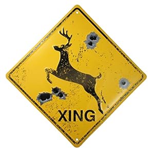 Yellow and black warning sign with deer