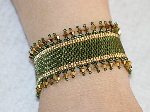 1133. Bead woven bracelet in gold and olive green with crystal border and a toggle tube clasp.