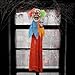 Halloween Haunters 3 Foot Hanging Circus Clown Head with Flashing Red LED Light Up Eyes Prop Decoration - Scary Menacing Ghoul Smile with Neon Red and Green Hair - Fun Entryway Display
