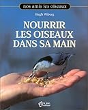 Nourrir les oiseaux dans sa main by