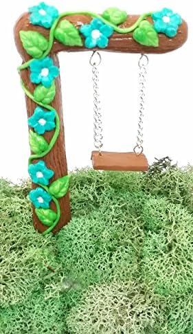 Fairy garden accessories Miniature fairy garden swing with blue flowers.