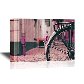Canvas Wall Art - Wheel of a Bicycle in a Town - Gallery Wrap Modern Home Art | Ready to Hang - 12x18 inches