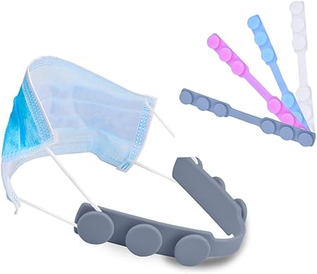 A model wearing a mask that is pulled together around the back of their head by the silicone ear saver, which has three different toggles on the back for sizing 