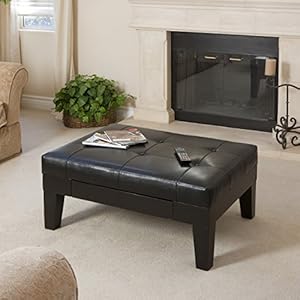 Black leather table infront of fireplace