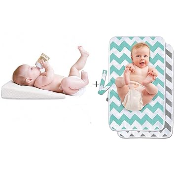 baby sleeping on changing pad