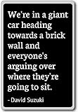 We're in a giant car heading towards a brick