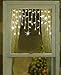 Sienna Twinkling and Shimmering Clear Window Curtain Christmas Icicle Lights with White Wire, Set of 50