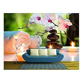 Massage Composition Spa with Candles Orchids Stones in Garden