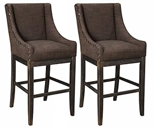 Two wingback style chairs with extended legs