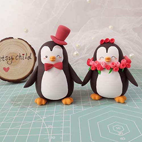 Unique wedding cake toppers Penguins bride
