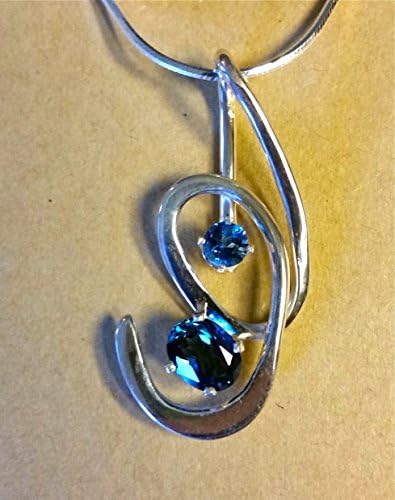 London Blue Topaz faceted gemstones set in an original Sterling Silver pendant with a Sterling Silver chain.