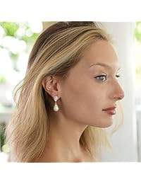 Mariell aretes de boda de circonia cúbica con forma de pera para novias con perlas crema suave