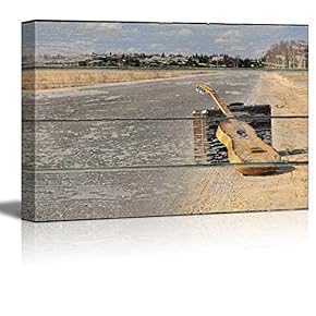 Travel Suitcase and Guitar on Vintage Wood Textured...