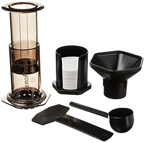 Aeropress kit spread out on white background