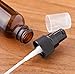 JUVITUS 1 oz / 30 ml Amber Glass Boston Round Bottle with Black Treatment Pump (4 Pack) + Travel Bag