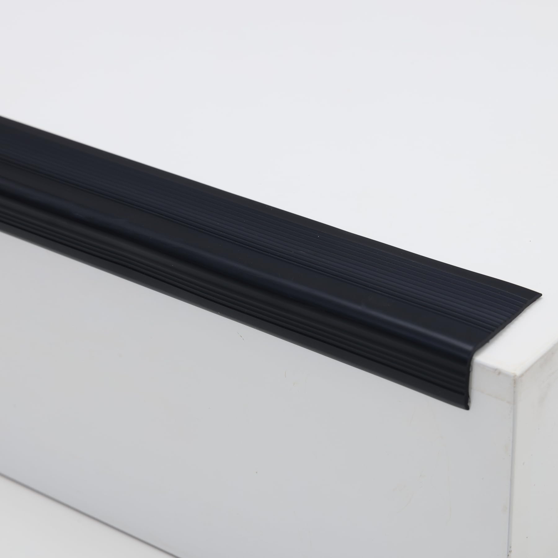Photo 1 of Trimold Vinyl Anti-Slip Stair Nosing, Self Adhesive Non-Slip Staircase Step, Flexible Rubber Treads Edge Protector Molding Trim for Outdoor & Indoor Uses (32.8ft, Black)