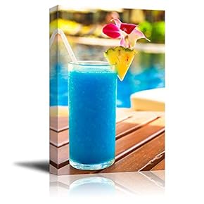 Tropical Blue Cocktail on a Beach Near a...