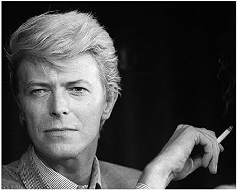 David Bowie Smoking In Checkered Suit With Styled Layered Hair