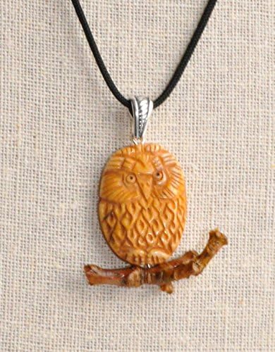 CARVED BONE OWL ON A WOODEN BRANCH WITH LEATHER CORD