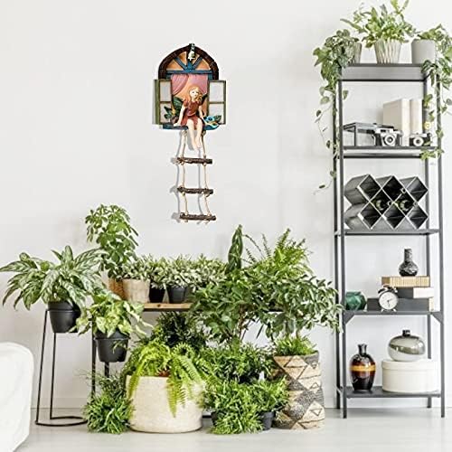 Fairy tree sculpture in a backyard setting.