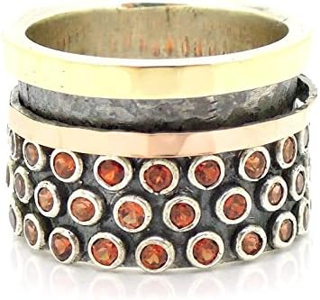 Garnet ring with a rose gold spinner, silver and yellow gold ring