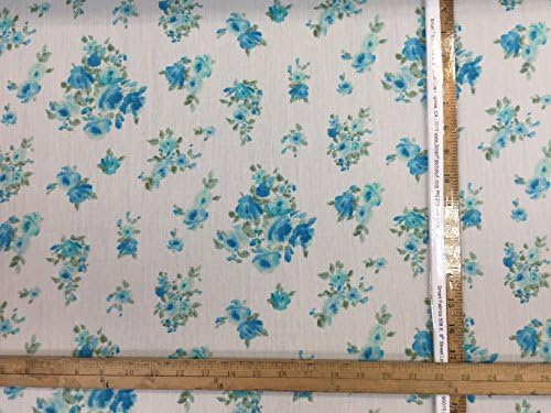 100% corrugated rayon challis. Ivory background. Dainty.l blue flowers. 60 inches wide. Fabric by the yard.