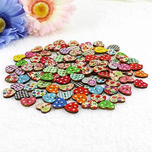 Colorful buttons and stitching on a painted surface for crafts and DIY ornament making.